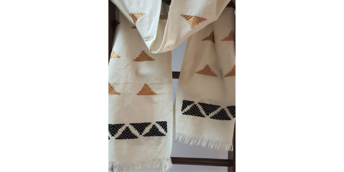 Nabha Phulkari handembroidered offwhite cotton stole with half motifs in black and gold colour threads.